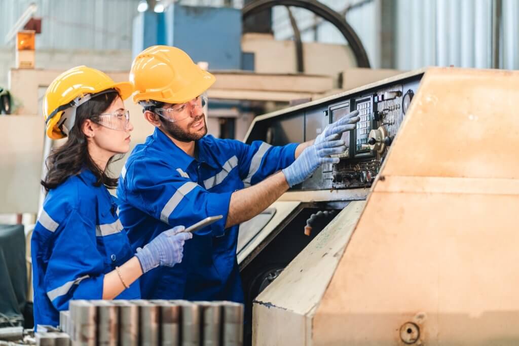 A Professional engineer team are working on PLC Control panel CNC machine